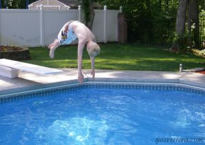 Boy diving into swimming pool